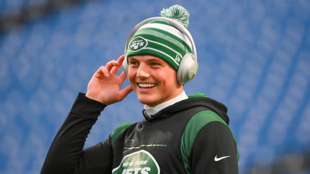 New York Jets QB Zach Wilson smiles during pregame workout